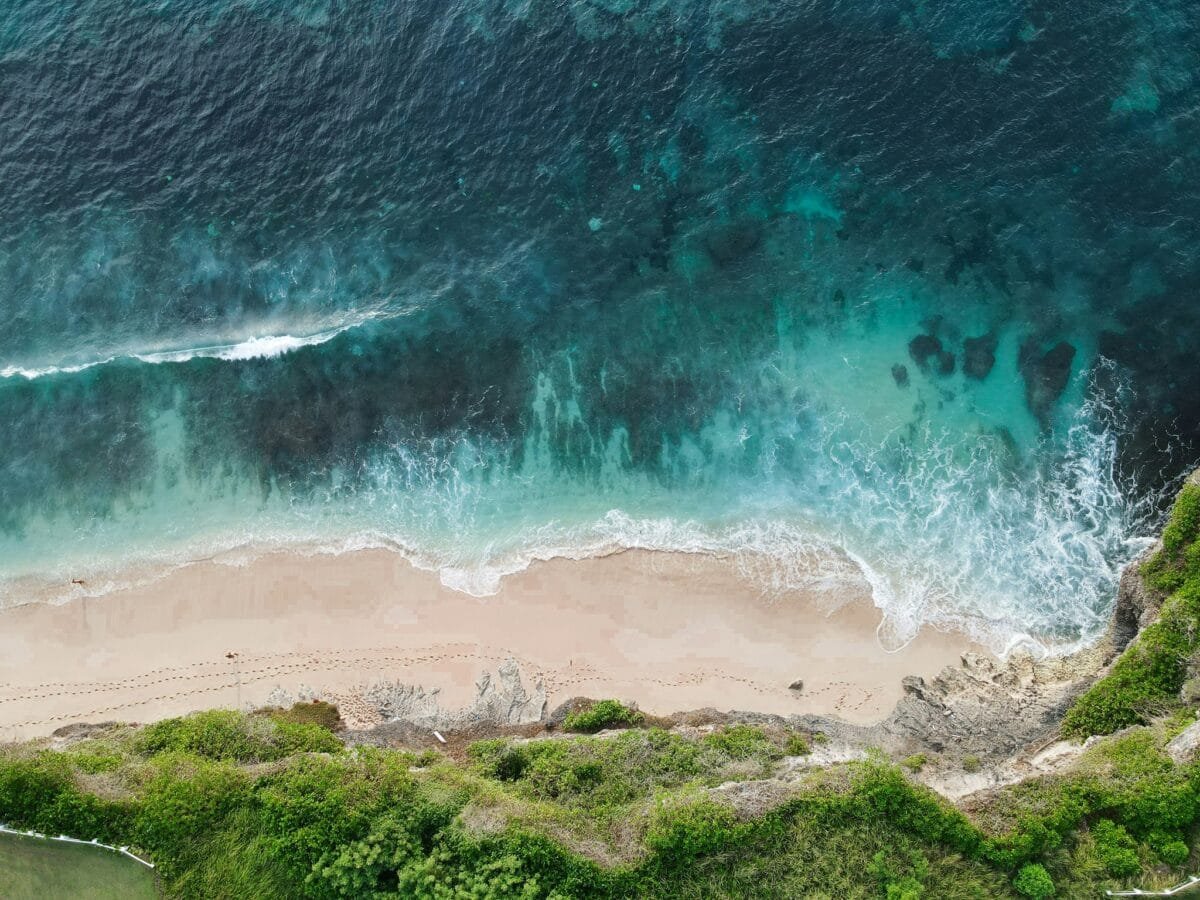 Uluwatu Temple perched on a cliff at sunset in Pecatu, Bali.