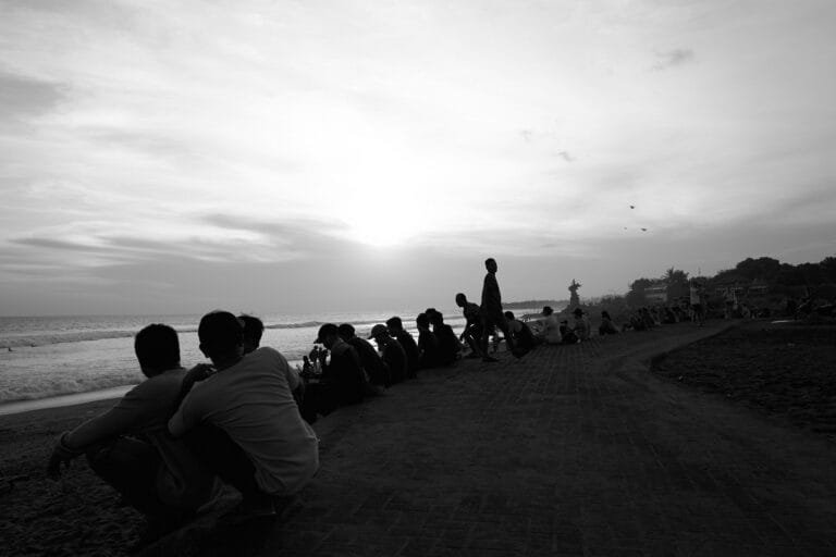 Surfer at sunset on Pererenan Beach in Bali.